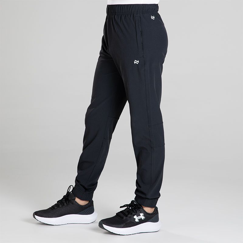 Black Kids’ Horizon Woven Tracksuit bottoms with two zip pockets by O’Neills.