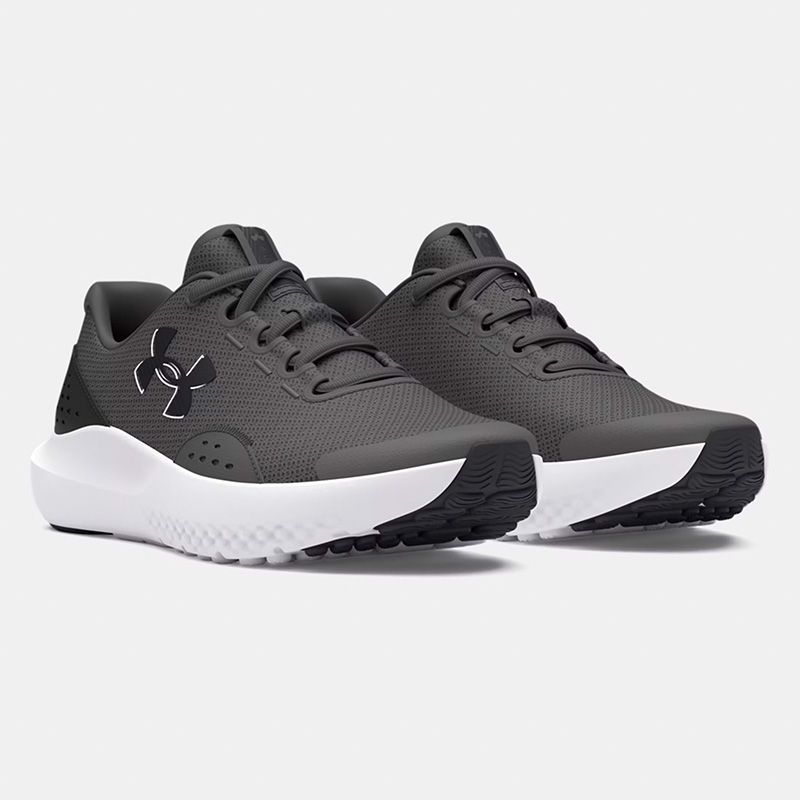Grey black and white Under Armour Kids' UA Surge 4 Youth Running Shoes from O'Neills