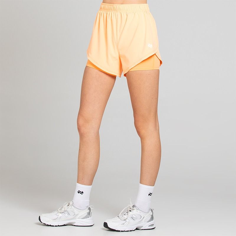 Peach Women's Finesse 2 in 1 Training Shorts from O’Neills with built in undershorts for extra coverage and support.
