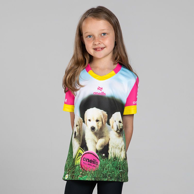Pink Kids’ Pup Fada O’Neills ploughing jersey with image of puppies and O’Neills Sliotars.