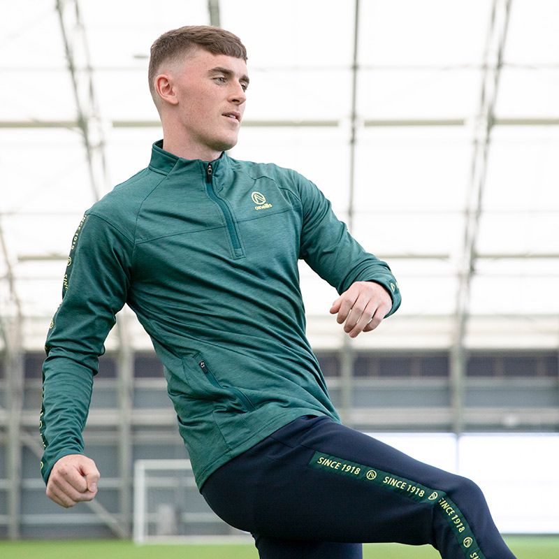 Green menâ€™s brushed half zip top with zip pockets and â€œSince 1918â€ branded taping on the sleeves by O’Neills.