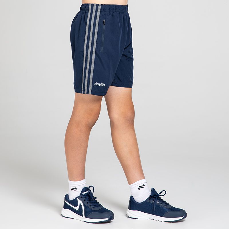 Navy Kids' O’Neills shorts with pockets and stripes on the sides by O’Neills.