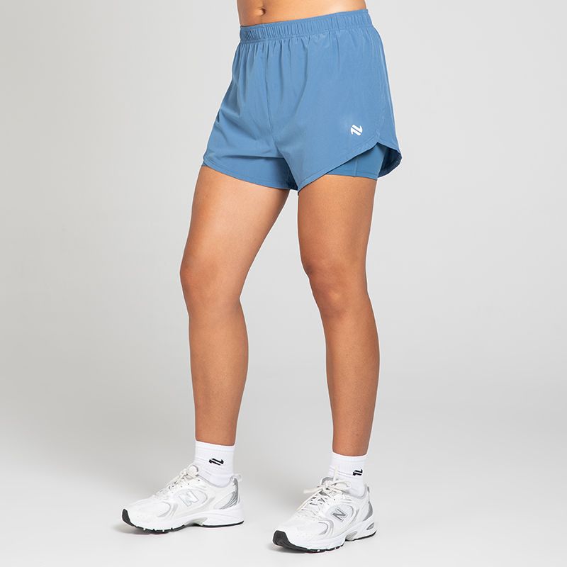 Blue Women's Finesse 2 in 1 Training Shorts from O’Neills with built in undershorts for extra coverage and support.