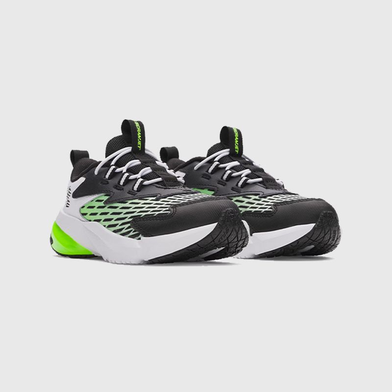 Kids' black and white Under Armour footwear with green detailing from O'Neills.