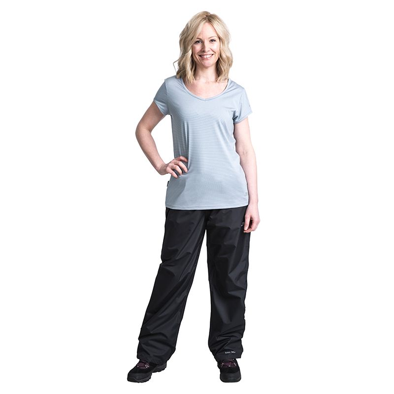 Black Trespass waterproof trousers with pockets and adjustable leg tags from O'Neills.