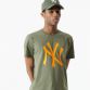 Green New Era t-shirt with orange New York Yankees logo on the front from O'Neills.