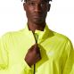 Yellow ASICS mens running rain jacket with pockets and reflective ASICS spiral logo from O'Neills.