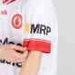 White / Red Kids' Tyrone Home Jersey 2024 with watermark image of Tyrone GAA crest on the front by O’Neills.