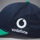 Navy and Green Canterbury IRFU Cap with white team branding and sponsor logo from O'Neills