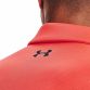 Men's orange Under Armour tech polo with the under arm logo on left chest from O'Neills.