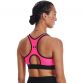 Women's Pink Under Armour Mid Sports Bra, with racer back design for enhanced range of motion from O'Neills.
