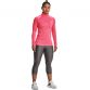Pink women's Under Armour half zip top with silver logo and shaped fit from O'Neills.