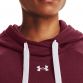 Burgandy women's Under Armour overhead hoodie with embroidered UA logo and white hood drawstrings from O'Neills.