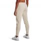 Beige women's Under Armour slim leg fleece joggers with pockets and cuffed bottoms from O'Neills.