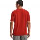 Red Under Armour men's seamless running t-shirt with black UA logo on uooer back from O'Neills.