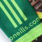 Green Men’s Dream Green O’Neills ploughing jersey with image of a green tractor and O’Neills ball on the front.