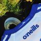 Blue Bluetiful Men's O'Neills Ploughing Jersey with blue New Holland tractor and tractor detail on back of collar.