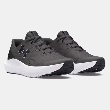 Grey black and white Under Armour Kids' UA Surge 4 Youth Running Shoes from O'Neills