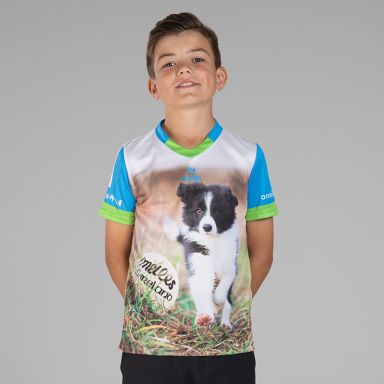 Blue Kids’ Cóilí O’Neills ploughing jersey with image of cute puppy and O’Neills ball on the front.