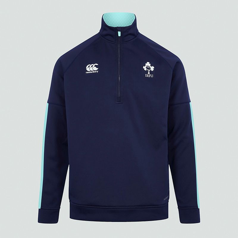 Navy Canterbury Kids' Ireland Half Zip Training Top, with Funnel neck with 1/2 zip opening and side pockets from O'Neills.