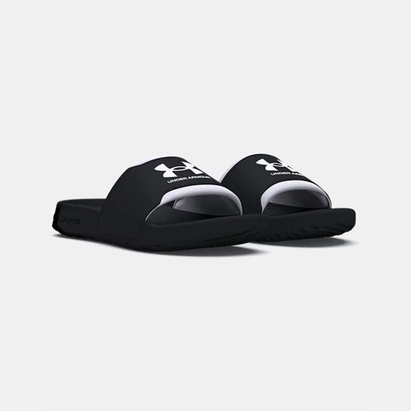 Women's black and white Under Armour sliders from O'Neills.