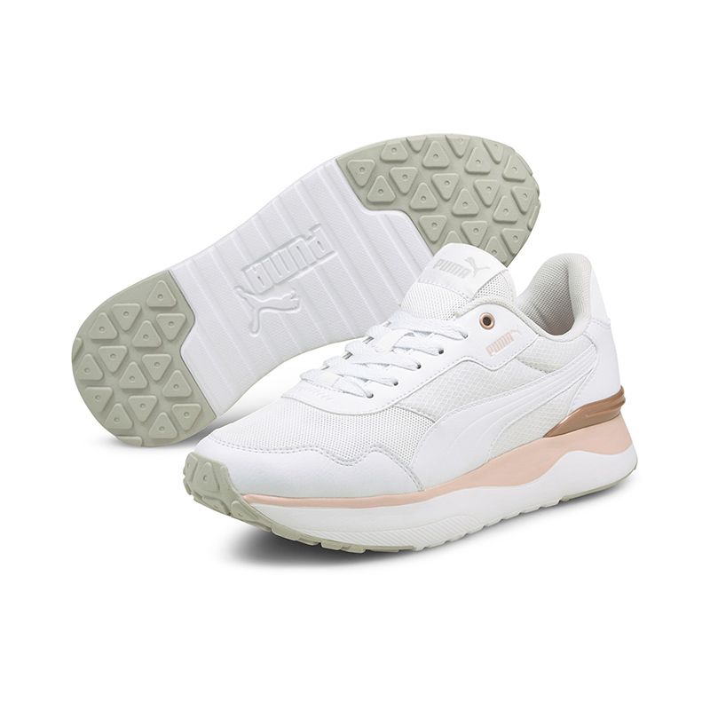 white and peach Puma kids' laced runners with a mesh upper and a low boot from O'Neills