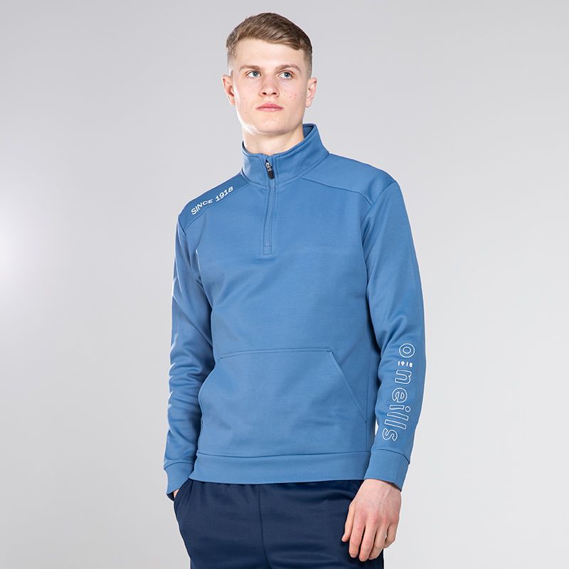 Blue / Silver Men’s Half Zip Top with “Since 1918” printed detail on the right shoulder by O’Neills.