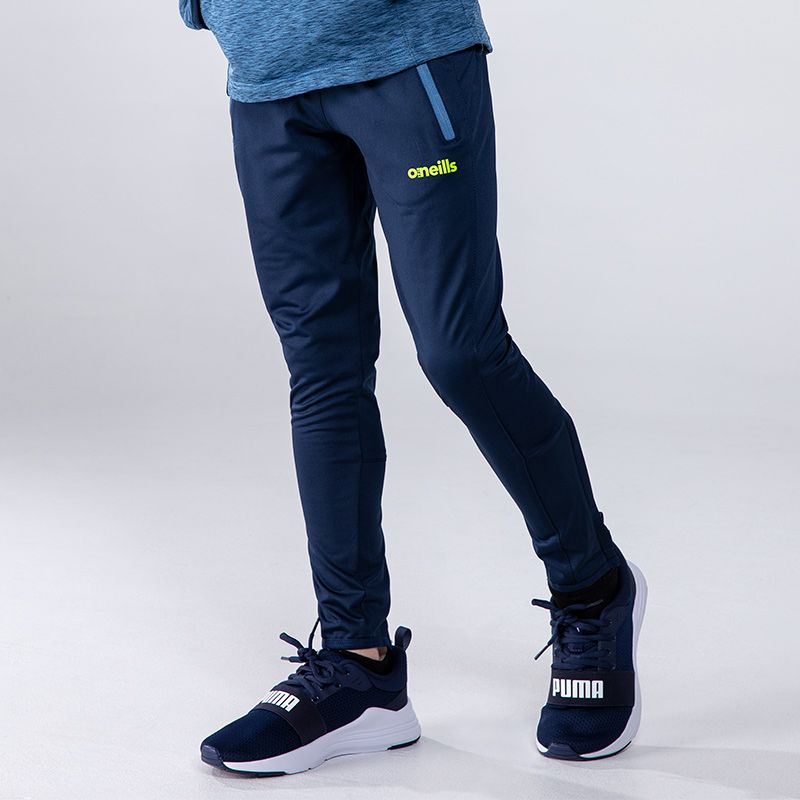 Marine / Green / Blue Boys’ brushed skinny tracksuit bottoms with two zip pockets and lower leg zips by O’Neills.