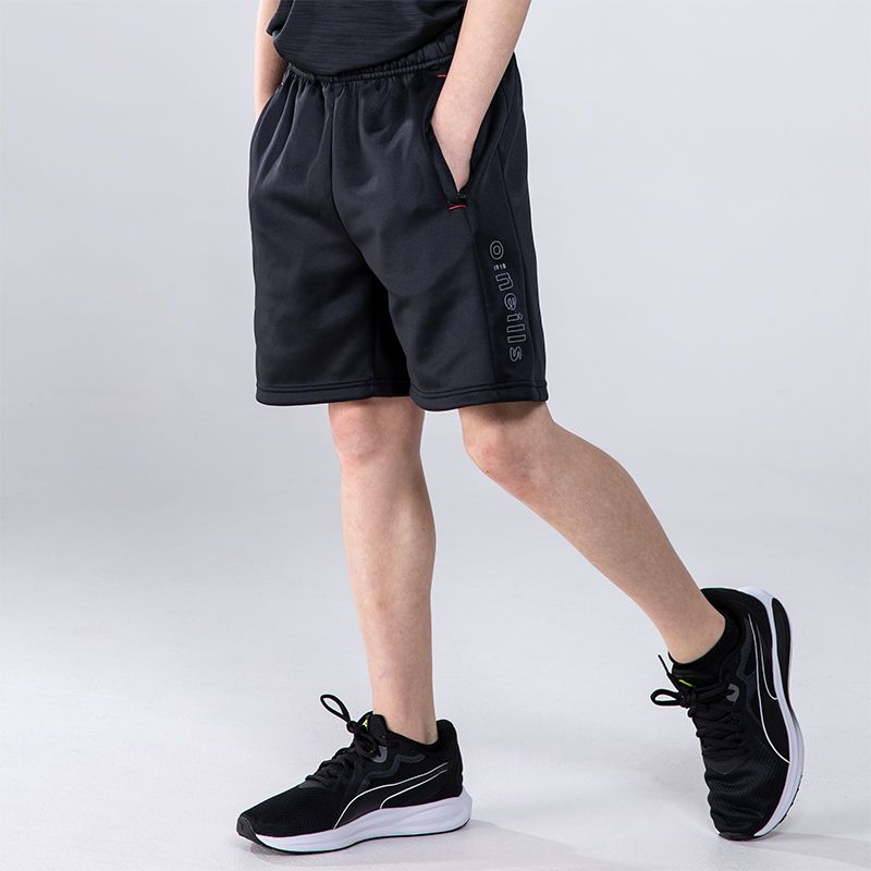 Black boys’ shorts with zip pockets and O’Neills 3D branding on the left leg by O'Neills.