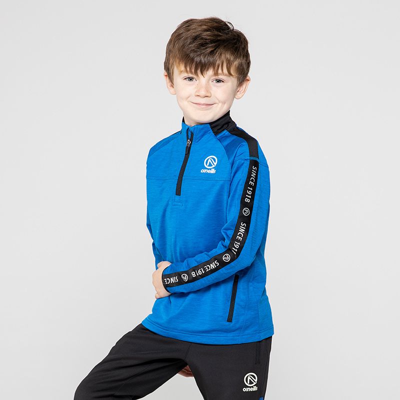 Blue Kids’ brushed half zip top with zip pockets and “Since 1918” branded taping on the sleeves by O’Neills.