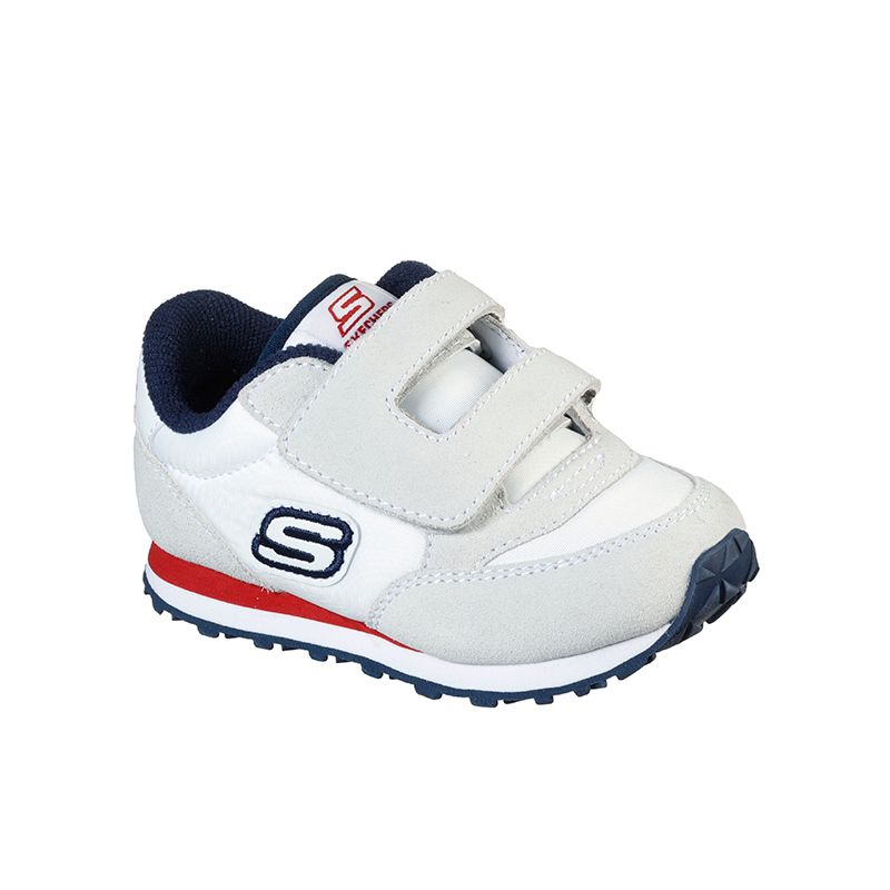 white, red and navy Skechers kids' runners with a soft suede and nylon fabric upper and velcro strap closure from O'Neills