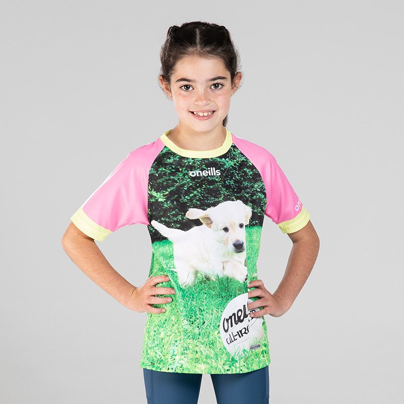 Pink Kids’ Think Paw-Sitive O’Neills ploughing jersey with image of a puppy and O’Neills ball on the front.