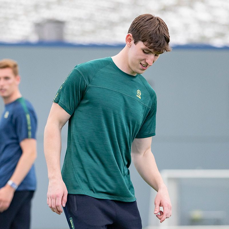 Green men’s training t-shirt with branded taping on the sleeves by O’Neills.