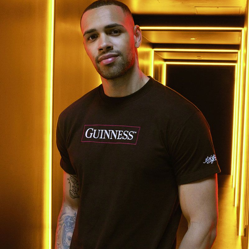 Black Guinness Men's T-Shirt with printed harp design on the back from O'Neills.