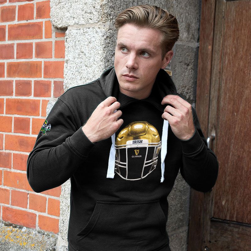 Black men's Guinness Hoodie with gold helmet print in the centre and Notre Dame Fighting Irish logo on the sleeve from O'Neills.