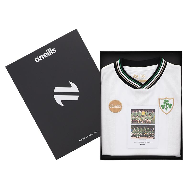 Kids’ Pearl White Ireland Premier Jersey with shamrock crest and crew neck collar packaged in a gift box by O’Neills.