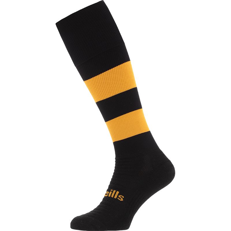 Black and Amber Koolite Max Elite Long Sports Socks with hooped design and turnover top by O’Neills. 
