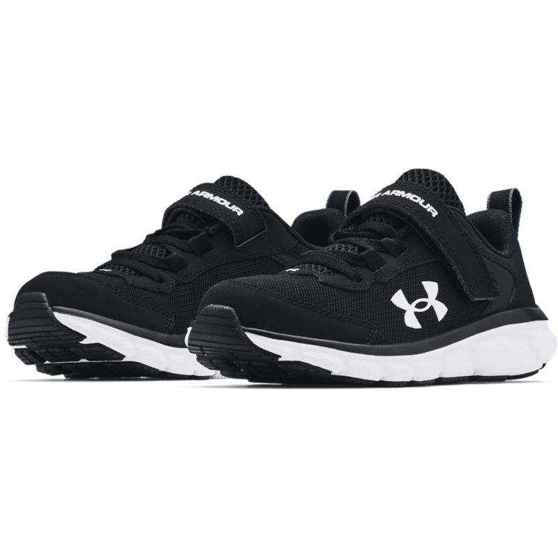 black and white Under Armour kids' runners with durable leather overlays from O'Neills